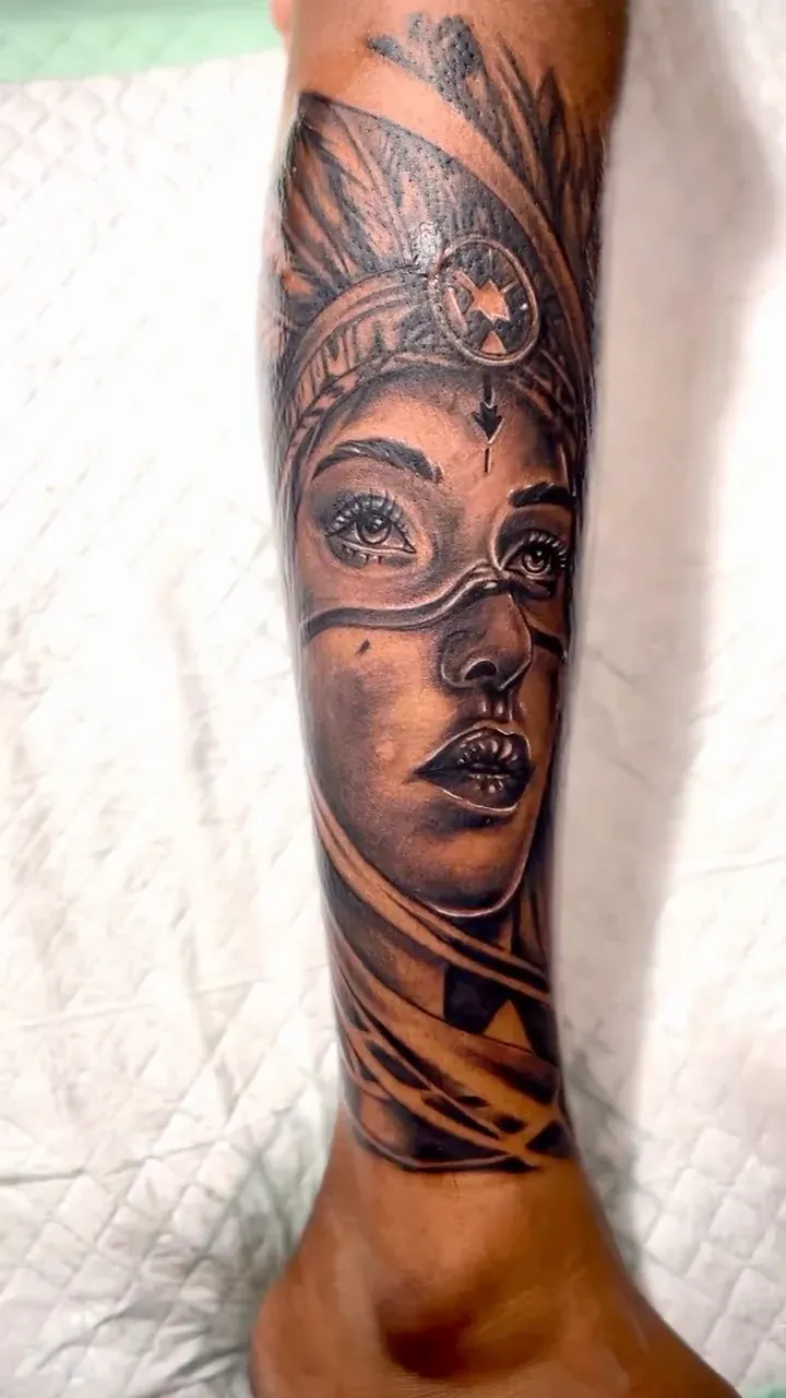 Realism portrait of a woman with a headdress and cosmic motifs on a forearm